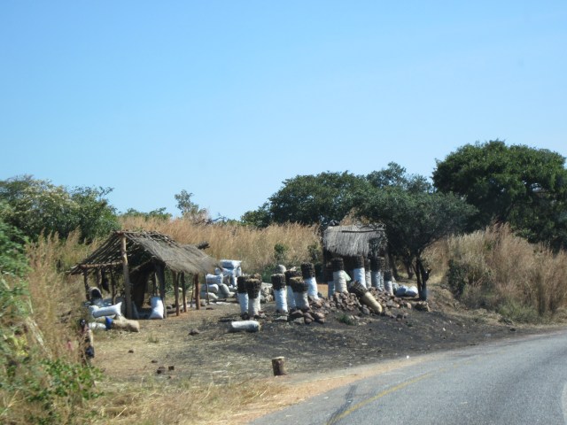 I confess, it's not the Great North Road but another of the Greats - it's the only picture I have of charcoal vending though and the quality's even worse than my usual standard because it's taken from a moving vehicle, sorry