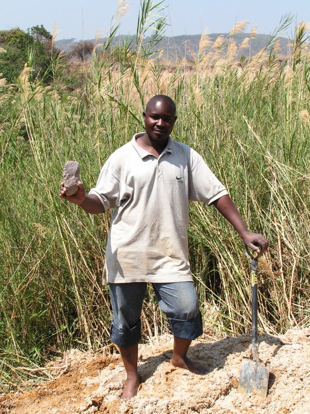 Victor holding a 400,000 year old cleaver he has discovered