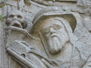 Who is this man with glasses and a skull?