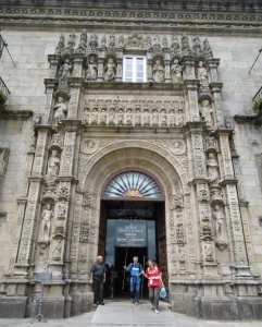 Two pilgrims leaving our hotel, Hostal Dos Reis Católicos