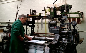 Graeme tending a Jacquard loom (runs on punch cards, complex patterns possible) made in Blackburn