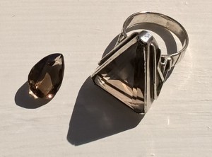 I gave my mum the teardrop shaped one, she never had it mounted. A jeweller in Shaftesbury, Dorset, turned the triangular one into a silver ring which became known as 'the ring of power'. Worn at important meetings, it was supposed to boost my confidence.